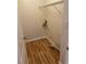 Bright laundry room with wooden floors, wire rack and washer hookups at 7981 Gossamer Dr, Fairburn, GA 30213