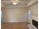 Bright living room featuring hardwood flooring and fireplace at 7981 Gossamer Dr, Fairburn, GA 30213