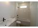 Bright bathroom with vanity, sink, and tiled shower/tub combo with white tile at 2012 Ripple Park Bnd, Canton, GA 30114