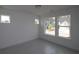 Bedroom with natural light from three windows and neutral paint at 2012 Ripple Park Bnd, Canton, GA 30114
