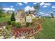 Stone sign welcomes you to Great Sky Crescent Pointe, surrounded by vibrant flowers and manicured landscaping at 2012 Ripple Park Bnd, Canton, GA 30114