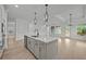A kitchen with an island, pendant lights, and stainless steel appliances at 2012 Ripple Park Bnd, Canton, GA 30114