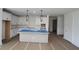 Bright kitchen with white cabinets, large island, and modern pendant lighting at 2012 Ripple Park Bnd, Canton, GA 30114