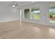 Spacious living room showcasing hardwood floors, windows, and a ceiling fan at 2012 Ripple Park Bnd, Canton, GA 30114