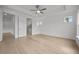 Main bedroom features hardwood floors, a ceiling fan, and a private bathroom entrance at 2012 Ripple Park Bnd, Canton, GA 30114