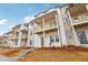 Row of inviting townhomes, each with a private balcony and well-maintained landscaping at 4659 Red Lion Pl, Lawrenceville, GA 30044