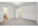 This room has neutral-toned walls, carpet flooring, and a doorway leading to another room at 4669 Red Lion Place Pl, Lawrenceville, GA 30044