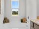 Relaxing bathroom with a large soaking tub and a window view at 8238 Walnut Hall Dr, Fairburn, GA 30213