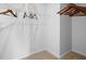 Large walk-in closet with ample hanging space and shelving at 8238 Walnut Hall Dr, Fairburn, GA 30213