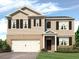 Two-story house with beige siding, brown accents, and a white three-car garage at 8238 Walnut Hall Dr, Fairburn, GA 30213