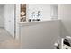 Bright hallway with access to bedrooms and other rooms at 8238 Walnut Hall Dr, Fairburn, GA 30213