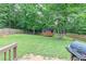 Spacious backyard with shed, deck, and grill at 1167 Mcclung Rd, Hiram, GA 30141