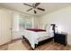 Comfortable bedroom with a queen bed, ceiling fan, and bright natural light at 1167 Mcclung Rd, Hiram, GA 30141