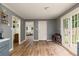 Open dining area featuring wood floors and double glass doors leading to the backyard at 1167 Mcclung Rd, Hiram, GA 30141