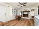 Inviting living room with a decorative fireplace, hardwood floors, and bright natural light at 1167 Mcclung Rd, Hiram, GA 30141