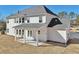 Rear view of home with a covered patio and large yard at 1421 Stephens View Dr, Loganville, GA 30052