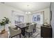 Elegant dining room with a dark wood table and a statement wall at 1421 Stephens View Dr, Loganville, GA 30052