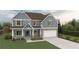 Two-story house with gray siding, brown roof, and landscaped lawn at 1421 Stephens View Dr, Loganville, GA 30052