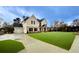 Two-story house with artificial turf lawn and driveway at 1421 Stephens View Dr, Loganville, GA 30052