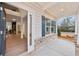 View of the front porch with wood-look floors and blue shutters at 1421 Stephens View Dr, Loganville, GA 30052