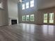 Great room with high ceilings, fireplace, and hardwood floors at 1421 Stephens View Dr, Loganville, GA 30052