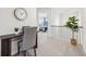 Hallway featuring a study nook with desk, chair, and view to a bedroom beyond the railing at 1421 Stephens View Dr, Loganville, GA 30052