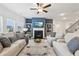 Inviting living room featuring a fireplace, built-in shelving, and plenty of natural light at 1421 Stephens View Dr, Loganville, GA 30052