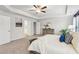 Bright main bedroom with tray ceiling, walk-in closet, large bed, and neutral color scheme at 1421 Stephens View Dr, Loganville, GA 30052