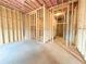 Unfinished basement featuring wood frame, exposed insulation, and plumbing and cement foundation at 5547 Bent Grass Way, Douglasville, GA 30135