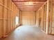 Unfinished basement featuring wood frame, exposed insulation, and natural light from the basement window at 5547 Bent Grass Way, Douglasville, GA 30135