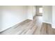 Neutral bedroom featuring light grey flooring and plenty of natural light from window at 5547 Bent Grass Way, Douglasville, GA 30135