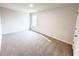 Bedroom featuring neutral carpeting and a window for natural light at 5547 Bent Grass Way, Douglasville, GA 30135