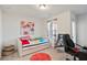 Cozy bedroom featuring a daybed and home office area at 7711 Cabrini Pl, Fairburn, GA 30213