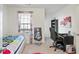 Bright bedroom with built-in workspace and window seating at 7711 Cabrini Pl, Fairburn, GA 30213