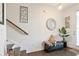 Bright entryway with bench, mirror, and hardwood floors at 7711 Cabrini Pl, Fairburn, GA 30213