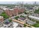 Expansive aerial shot of building with brick exterior, parking, and skyline views at 785 Ponce De Leon Ne Pl # 8, Atlanta, GA 30306