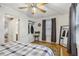 Bedroom with hardwood floors, ceiling fan, and ample closet space at 785 Ponce De Leon Ne Pl # 8, Atlanta, GA 30306