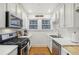 Bright kitchen with white cabinets and stainless steel appliances at 785 Ponce De Leon Ne Pl # 8, Atlanta, GA 30306