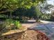 Community entrance to Vinings Central Condominiums, featuring a stone sign and landscaping at 2776 Vinings Central Se Dr # 19, Atlanta, GA 30339