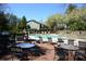 Community pool with deck furniture and grill at 2776 Vinings Central Se Dr # 19, Atlanta, GA 30339