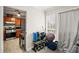 Small room with exercise equipment and kitchen view at 366 Oak Harbor Trl, Marietta, GA 30066