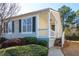 Tan colored house with white porch and landscaping at 366 Oak Harbor Trl, Marietta, GA 30066