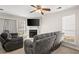 Living room with fireplace, ceiling fan, and couches at 366 Oak Harbor Trl, Marietta, GA 30066