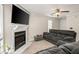 Living room with fireplace, couches, and ceiling fan at 366 Oak Harbor Trl, Marietta, GA 30066