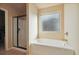 Clean bathroom with a bathtub and separate shower stall at 5105 Deepwater Cv, Acworth, GA 30101