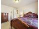 Spacious bedroom with a large wooden bed and dresser at 5105 Deepwater Cv, Acworth, GA 30101