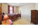 Cozy bedroom with a queen-size bed and wood furniture at 5105 Deepwater Cv, Acworth, GA 30101