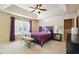 Spacious bedroom with a king-size bed and ceiling fan at 5105 Deepwater Cv, Acworth, GA 30101