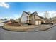 Side view of the house showcasing landscaping and driveway at 5105 Deepwater Cv, Acworth, GA 30101
