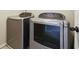 Convenient laundry room with matching washer and dryer set at 5105 Deepwater Cv, Acworth, GA 30101